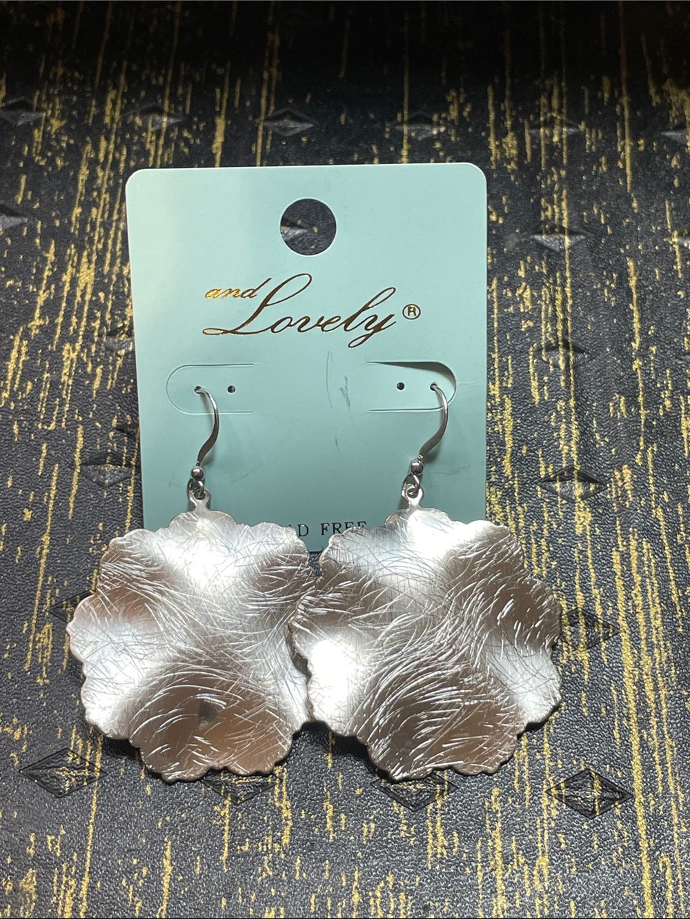 andLovely Silver Floral Drop Earrings